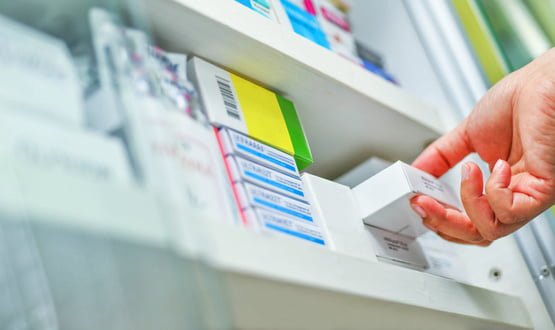 A shelf of medication at a pharmacy