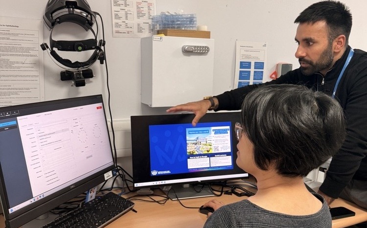 Asad Khokhar, implementation project manager at Medisoft training a staff member at Royal Surrey NHS Foundation Trust