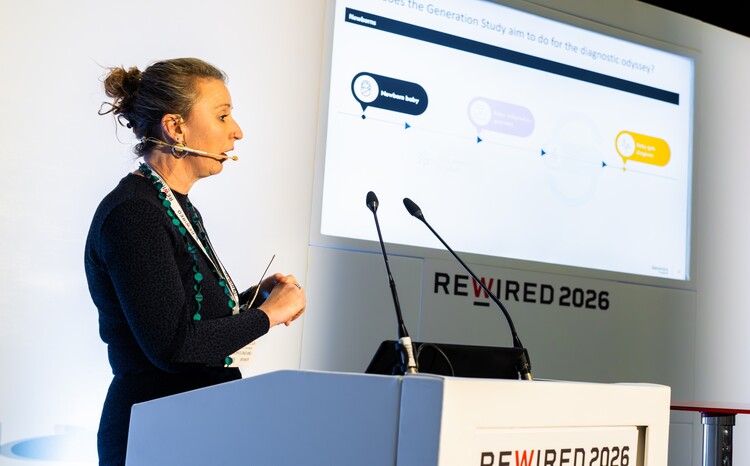 Jenna Cusworth-Bolger, senior service designer at Genomics England talking on the stage at Rewired 2026
