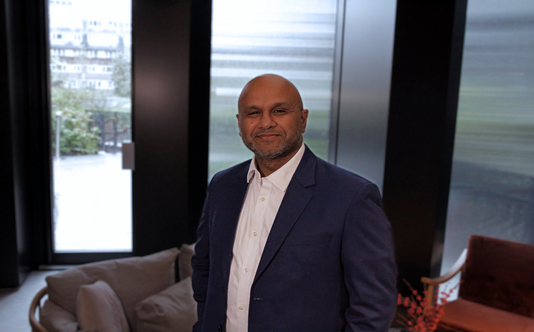 Mohammad Al-Ubaydli, chief executive of Patients Know Best, standing in a living room