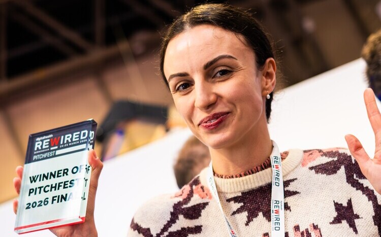 Valentina Milanova, founder and chief executive of Daye, hold up her Pitchfest trophy