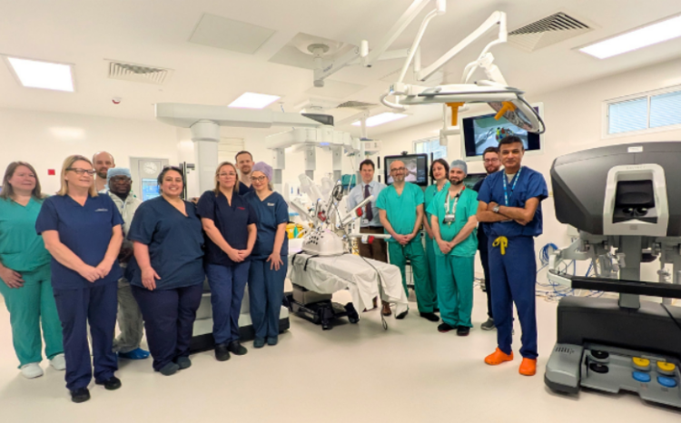 Surgeons, nurses, theatre operating staff, anaesthetists, planning and estates teams at Sheffield Teaching Hospitals NHS Foundation Trust together with Sheffield Hospitals Charity at a ribbon-cutting event for the new robot last week